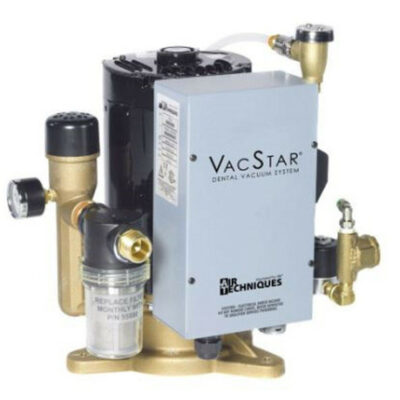 Dental vacuum system labeled VacStar with brass fittings and a filter canister for a dental office