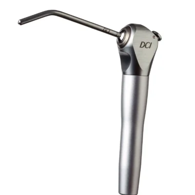 Close-up of a metallic dental handpiece with a curved attachment and DCI logo on the head