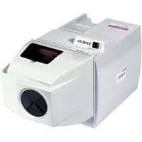 Compact white laboratory instrument with a front-loading circular port and small digital display on top, used for sample processing.