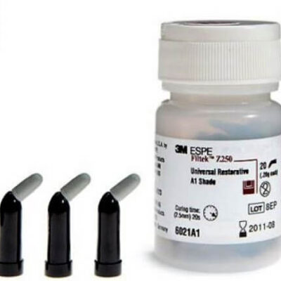 Bottle of 3M ESPE Filtek Universal Restorative resin in A1 shade with three disposable applicator tips placed beside it